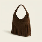 Brown faux suede fringe bag, three-quarter angle showing side depth