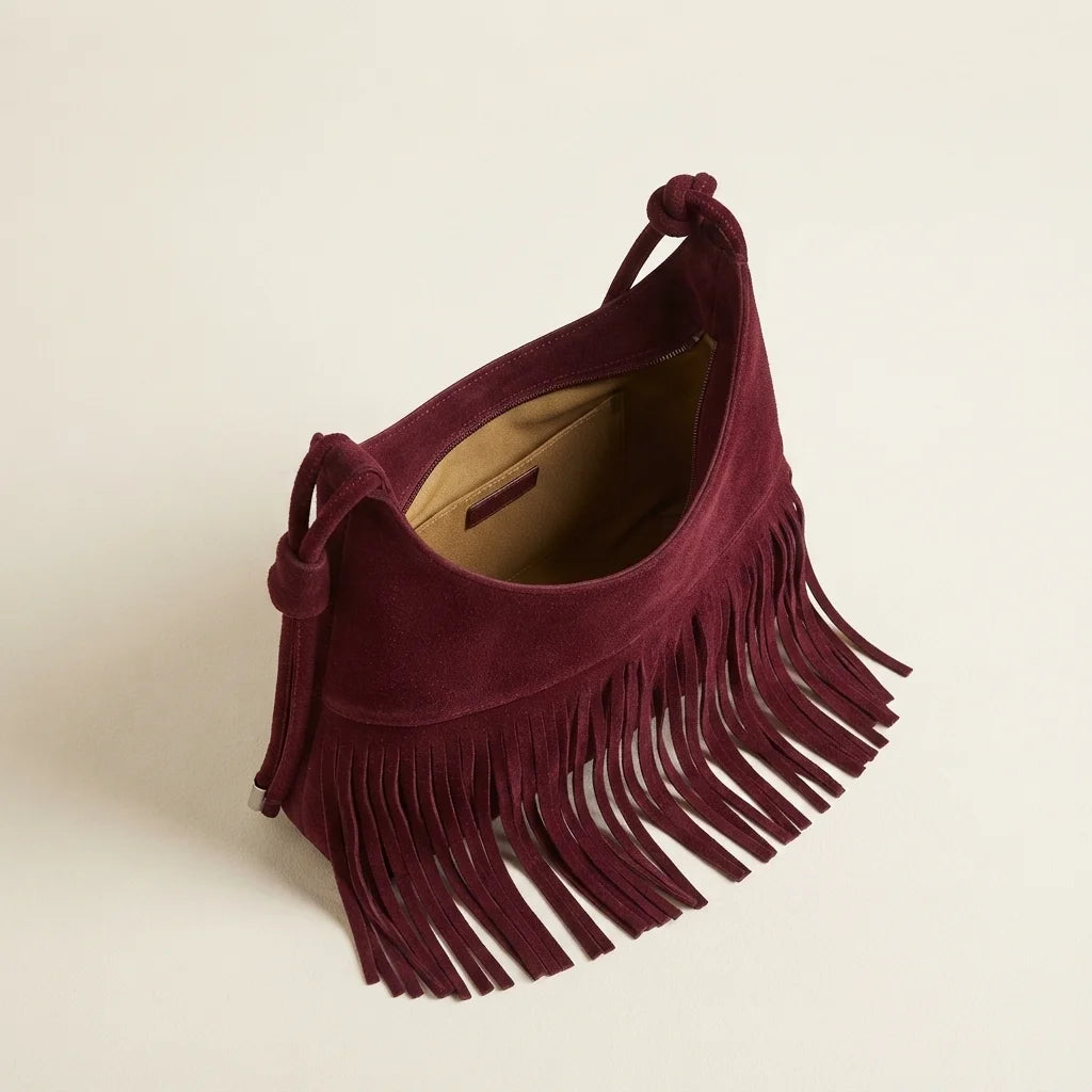 Interior lining and pockets of Burgundy faux suede fringe bag