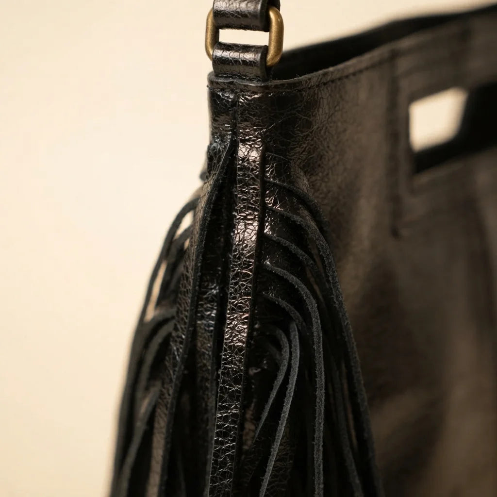 Close-up of fringe stitching and texture on Black fringe backpack shoulder bag