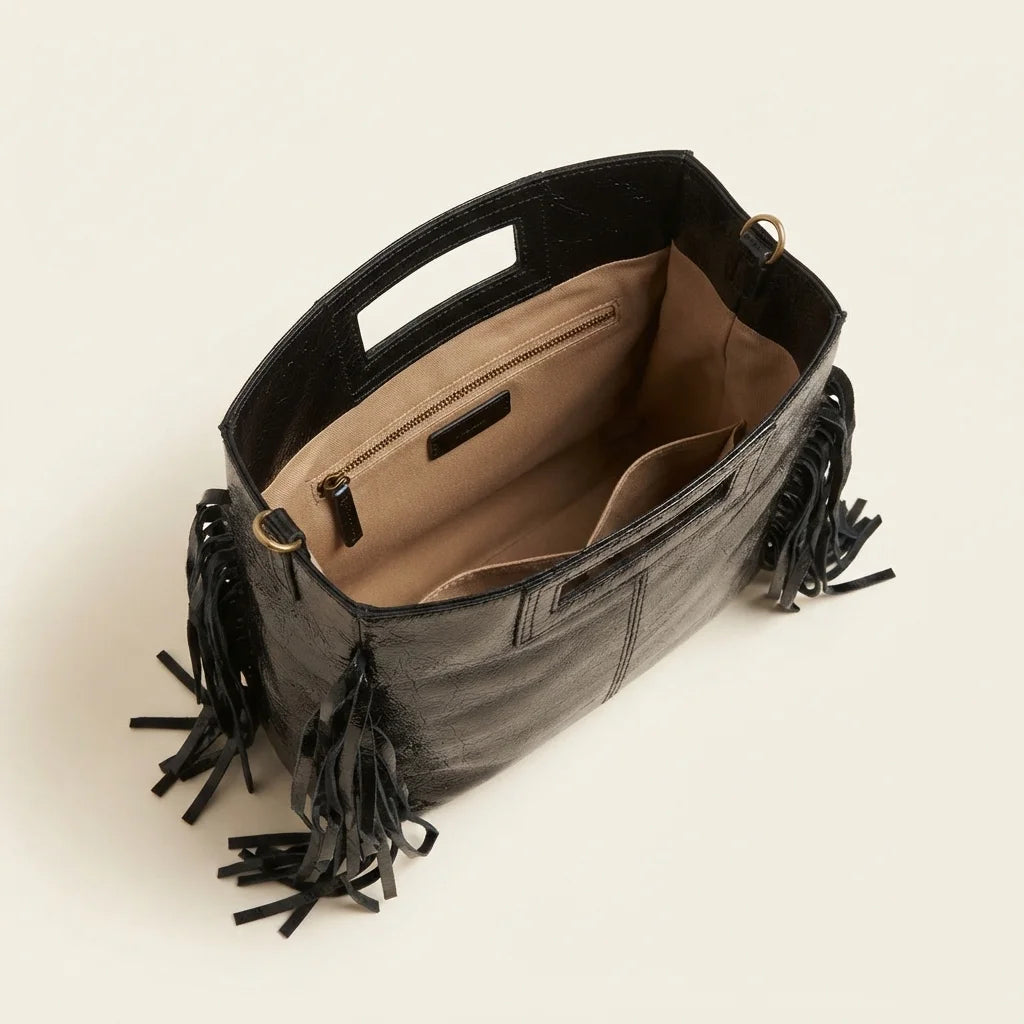 Interior lining and pockets of Black fringe backpack shoulder bag