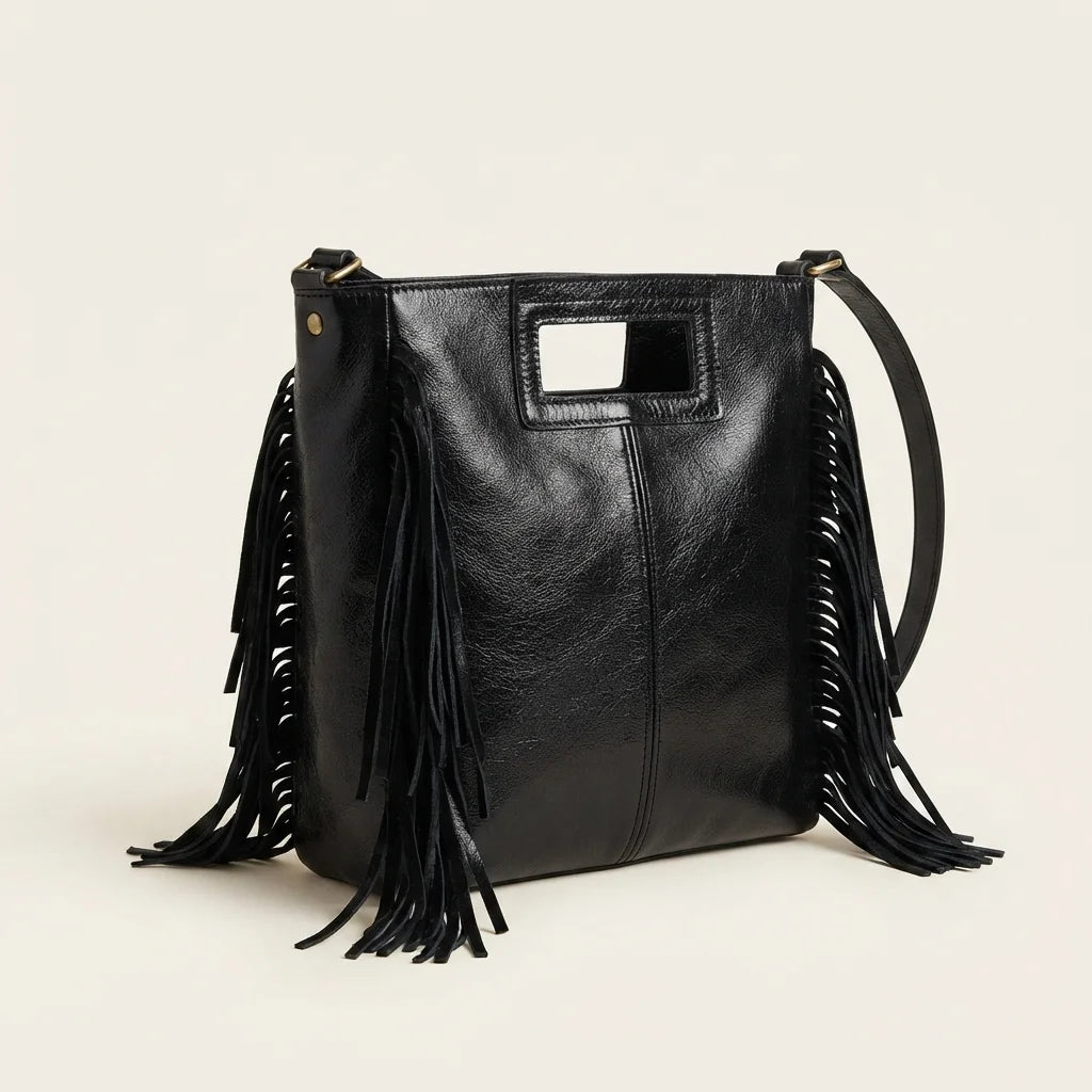 Black fringe backpack shoulder bag, three-quarter angle showing side depth