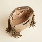 Interior lining and pockets of Champagne fringe backpack shoulder bag