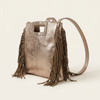 Champagne fringe backpack shoulder bag, three-quarter angle showing side depth