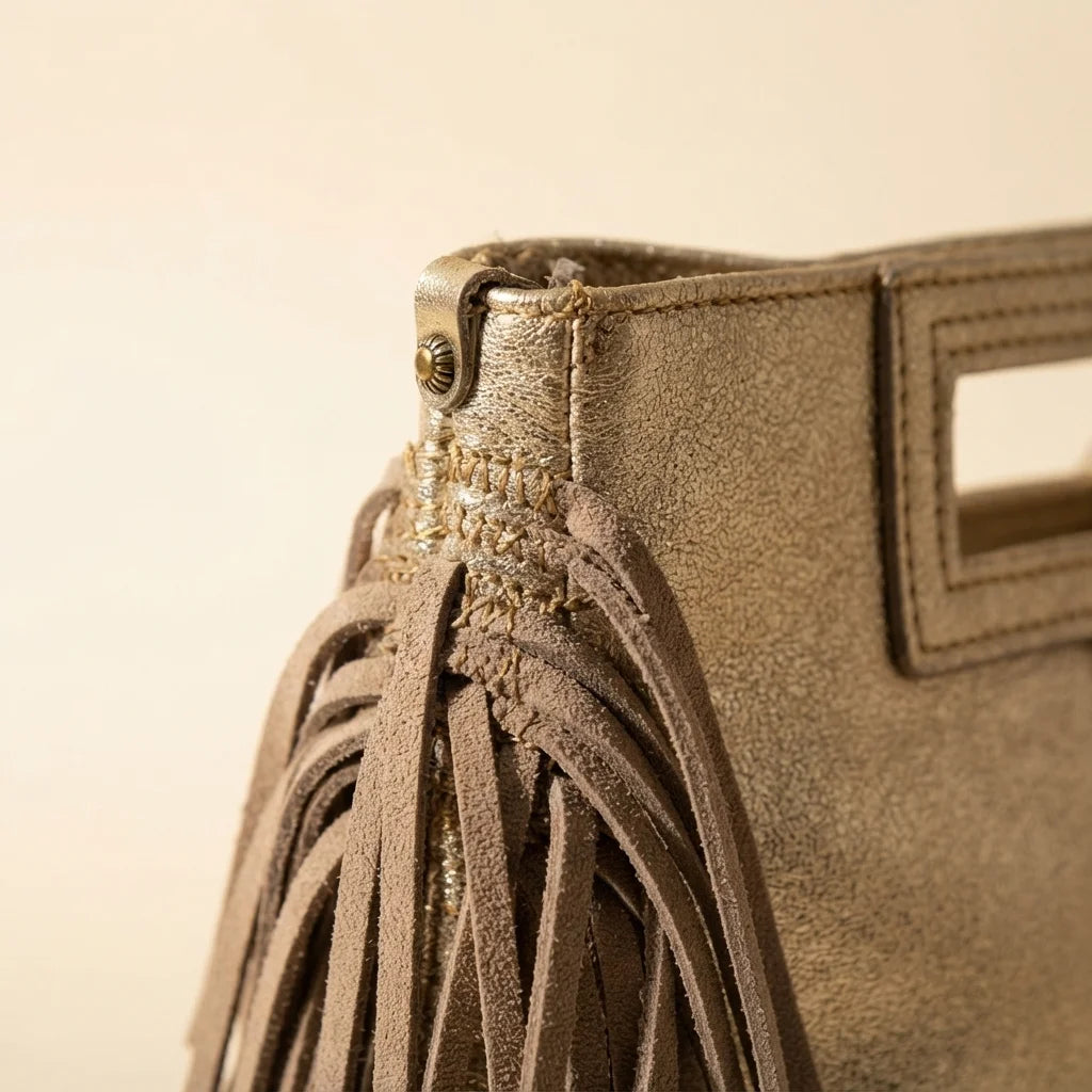 Close-up of fringe stitching and texture on Gold fringe backpack shoulder bag