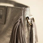 Close-up of fringe stitching and texture on Silver fringe backpack shoulder bag