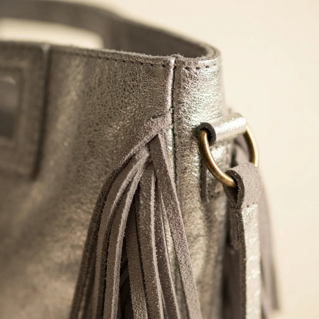 Close-up of fringe stitching and texture on Silver fringe backpack shoulder bag