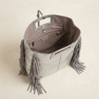 Interior lining and pockets of Silver fringe backpack shoulder bag