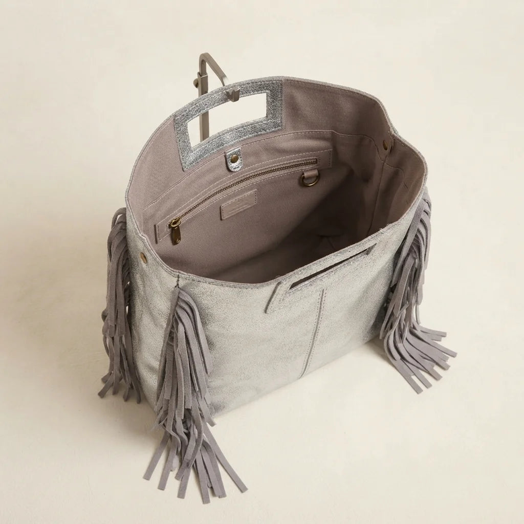 Interior lining and pockets of Silver fringe backpack shoulder bag