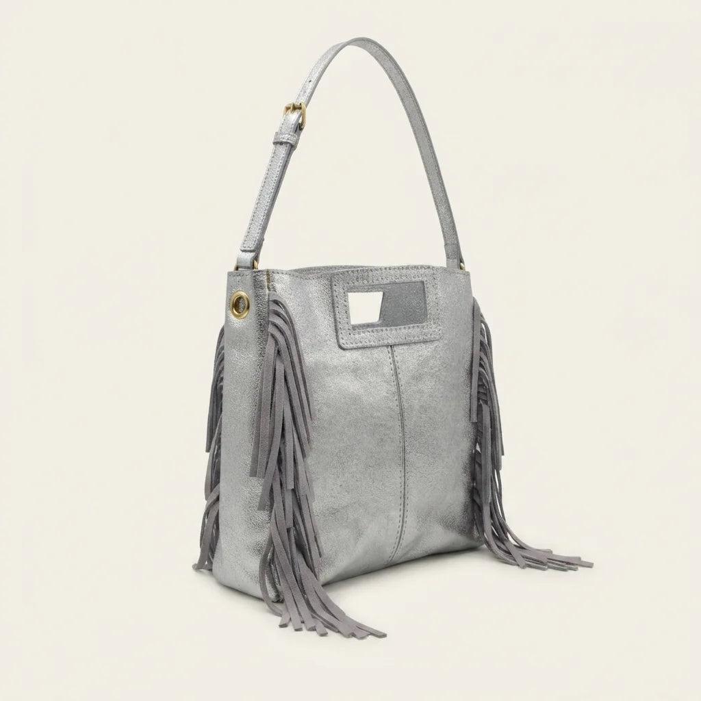 Silver fringe backpack shoulder bag, three-quarter angle showing side depth