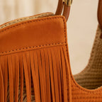 Close-up of fringe stitching and texture on Orange fringe beach bag