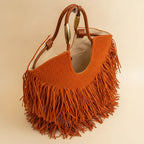 Interior lining and pockets of Orange fringe beach bag