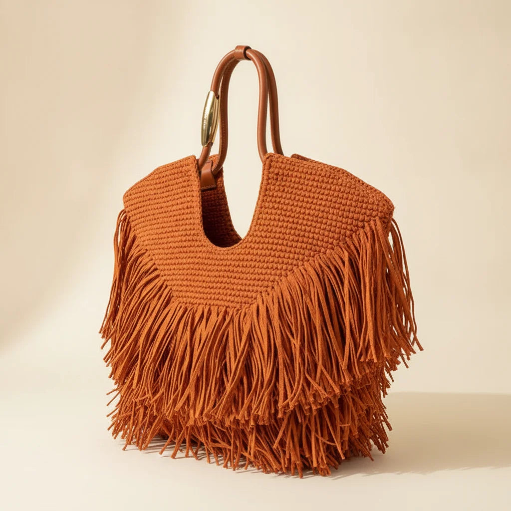 Orange fringe beach bag, three-quarter angle showing side depth