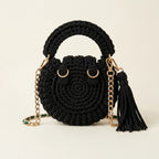 Back panel of Black fringe bucket bag crossbody with strap attachments