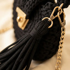 Close-up of fringe stitching and texture on Black fringe bucket bag crossbody