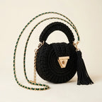 Black fringe bucket bag crossbody, three-quarter angle showing side depth