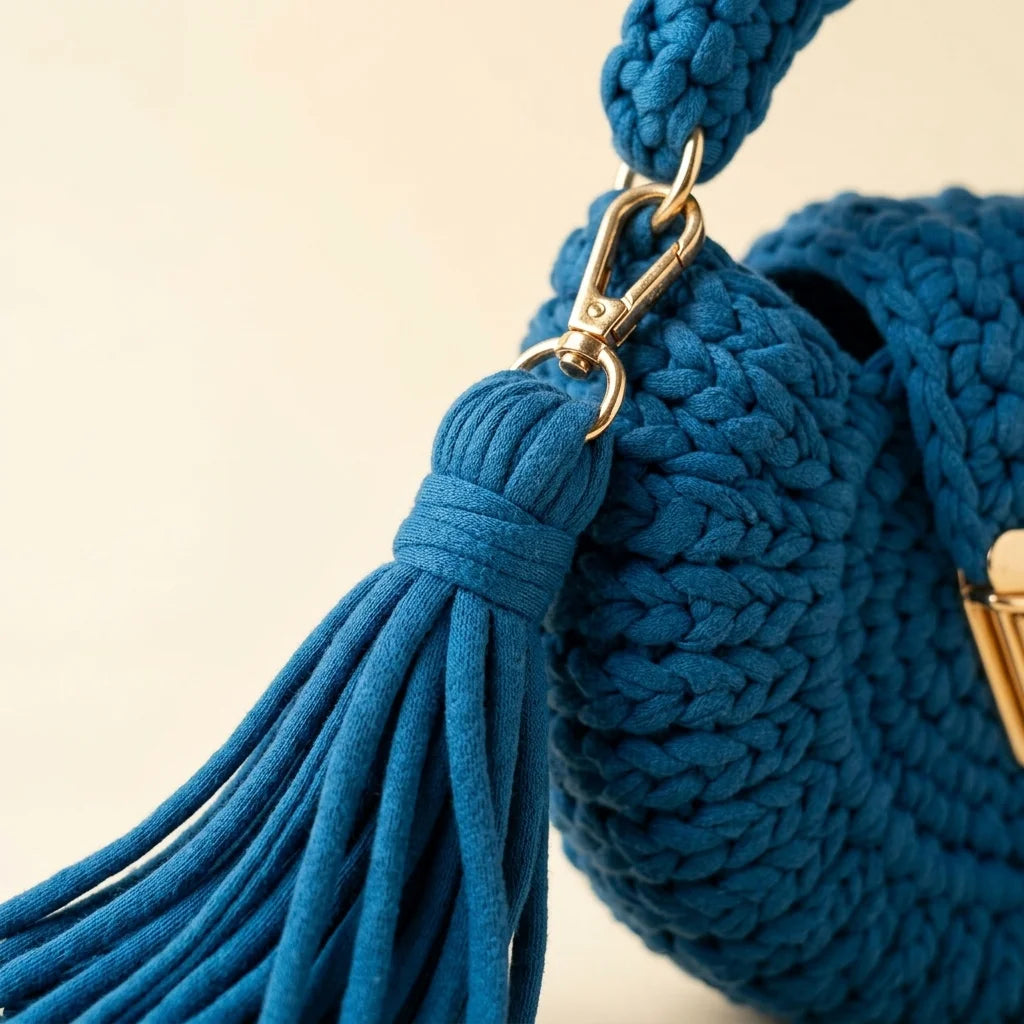 Close-up of fringe stitching and texture on Blue fringe bucket bag crossbody
