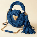 Blue fringe bucket bag crossbody, three-quarter angle showing side depth