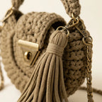 Close-up of fringe stitching and texture on Khaki fringe bucket bag crossbody
