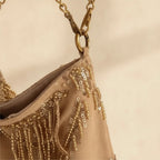 Close-up of fringe stitching and texture on Light Brown fringe chain bag