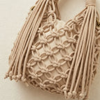 Close-up of fringe stitching and texture on Beige fringe clutch bag designer