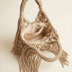 Interior lining and pockets of Beige fringe clutch bag designer