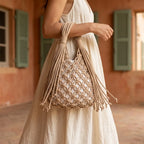 Woman wearing Beige fringe clutch bag designer with swaying fringe