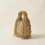 Gold fringe clutch bag designer, three-quarter angle showing side depth