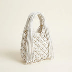 White fringe clutch bag designer, three-quarter angle showing side depth
