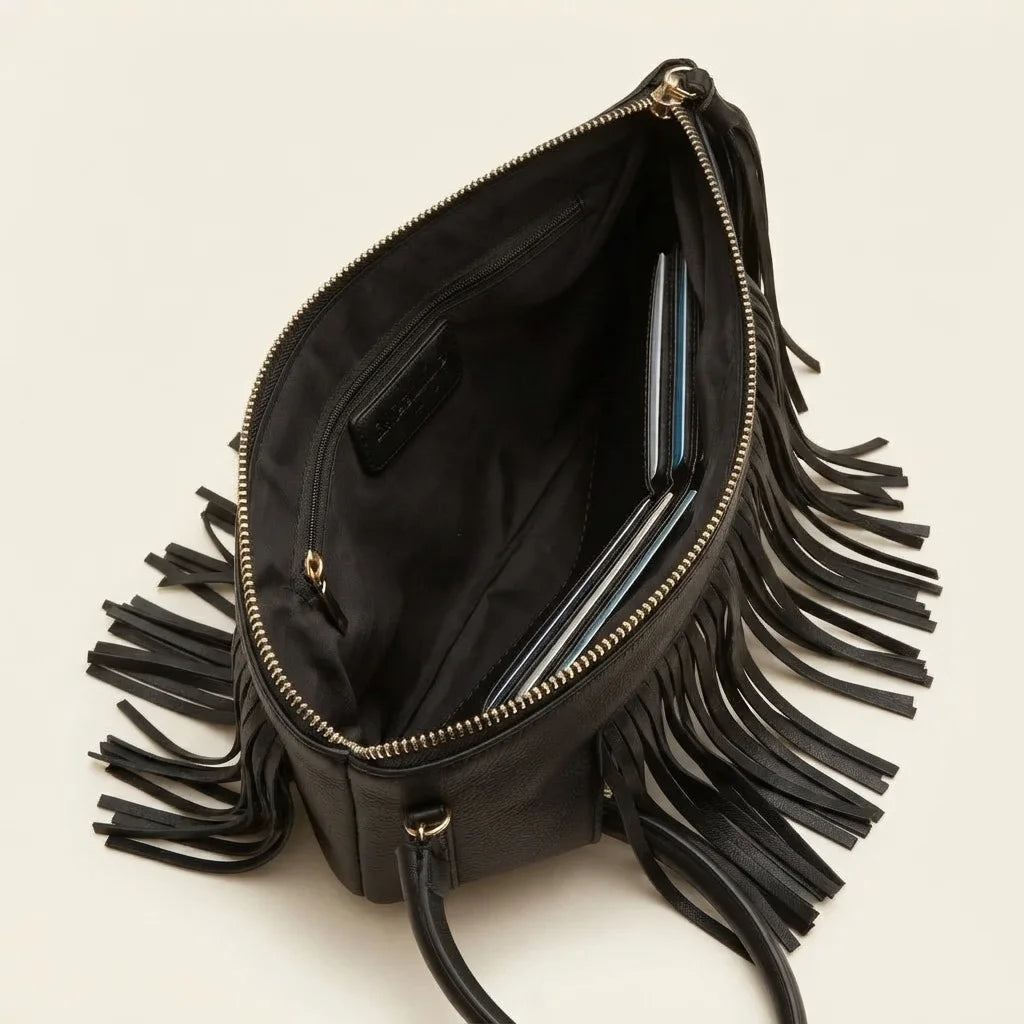 Interior lining and pockets of Black fringe clutch bag leather