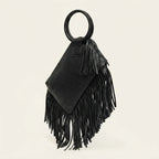 Black fringe clutch bag leather, three-quarter angle showing side depth