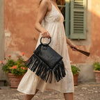 Woman wearing Black fringe clutch bag leather with swaying fringe