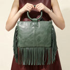Back panel of Green fringe clutch bag leather with strap attachments