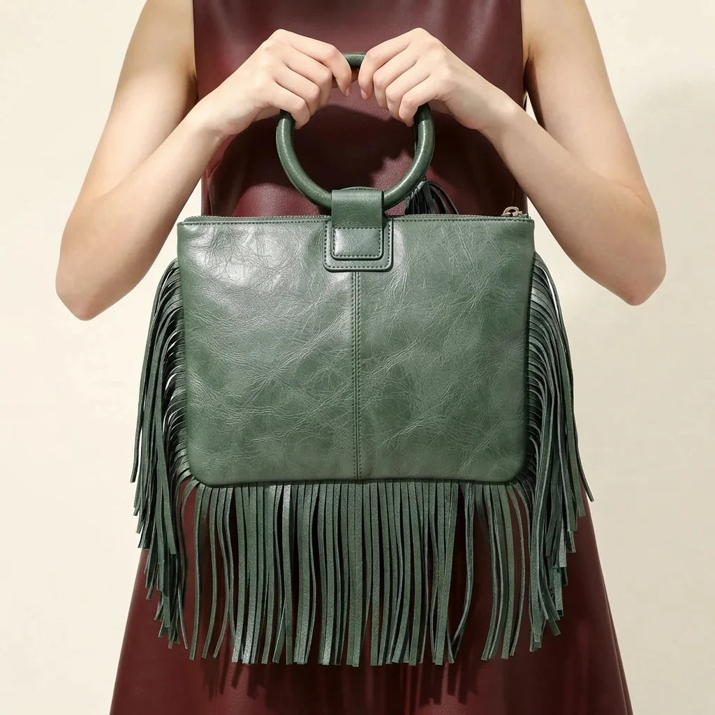 Back panel of Green fringe clutch bag leather with strap attachments
