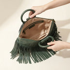 Interior lining and pockets of Green fringe clutch bag leather