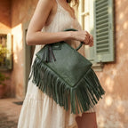 Woman wearing Green fringe clutch bag leather with swaying fringe