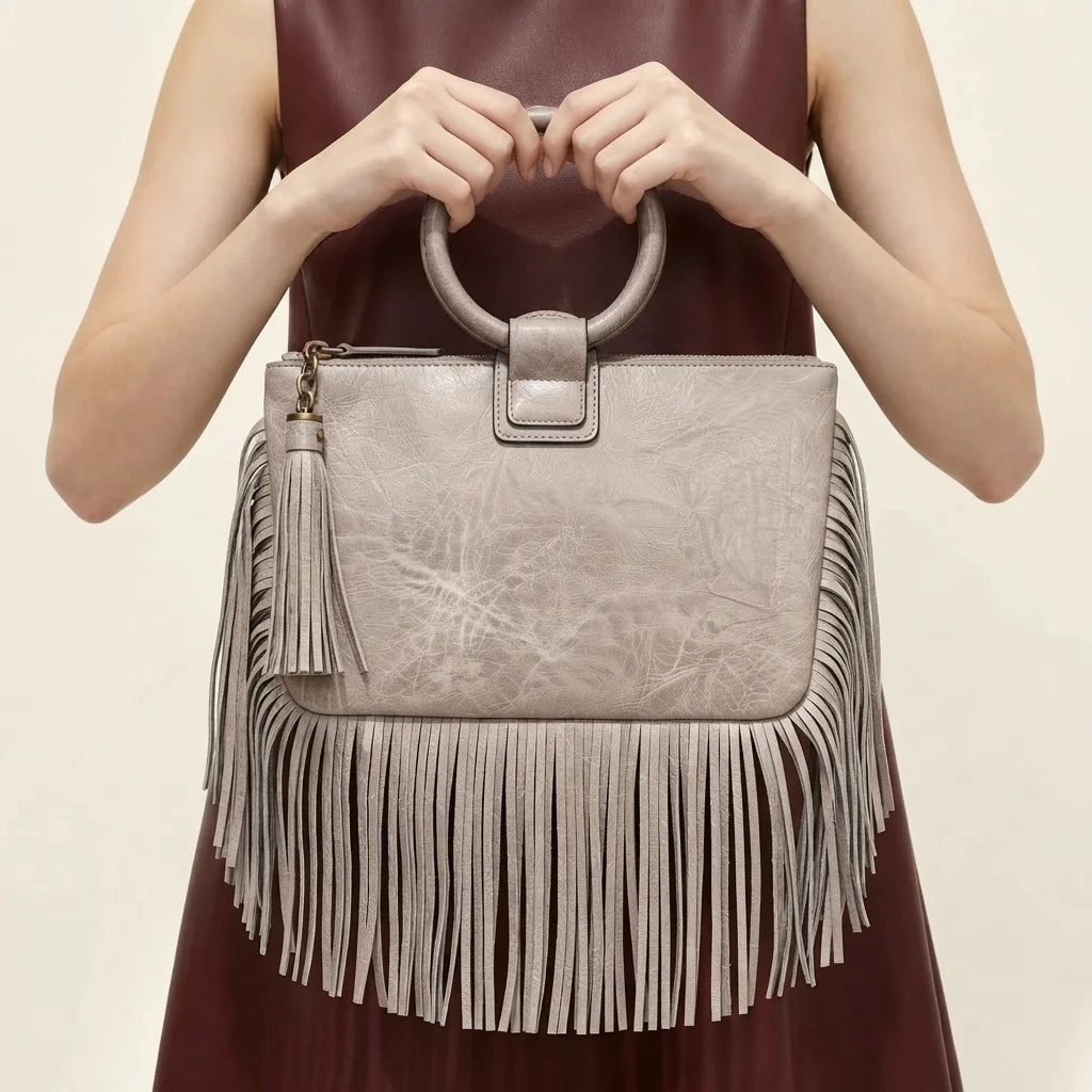 Grey fringe clutch bag leather, front view
