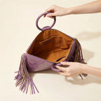 Interior lining and pockets of Purple fringe clutch bag leather