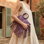 Woman wearing Purple fringe clutch bag leather with swaying fringe