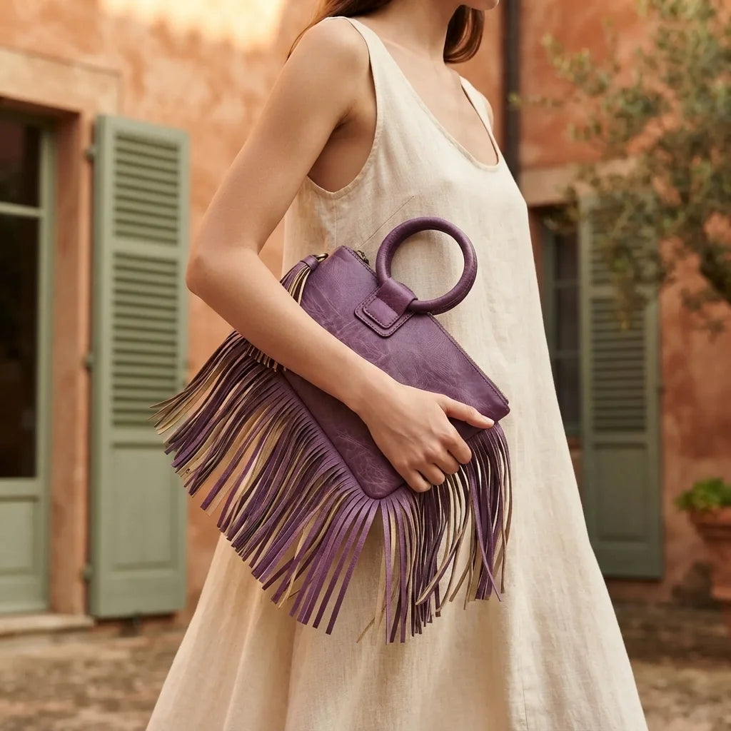 Woman wearing Purple fringe clutch bag leather with swaying fringe