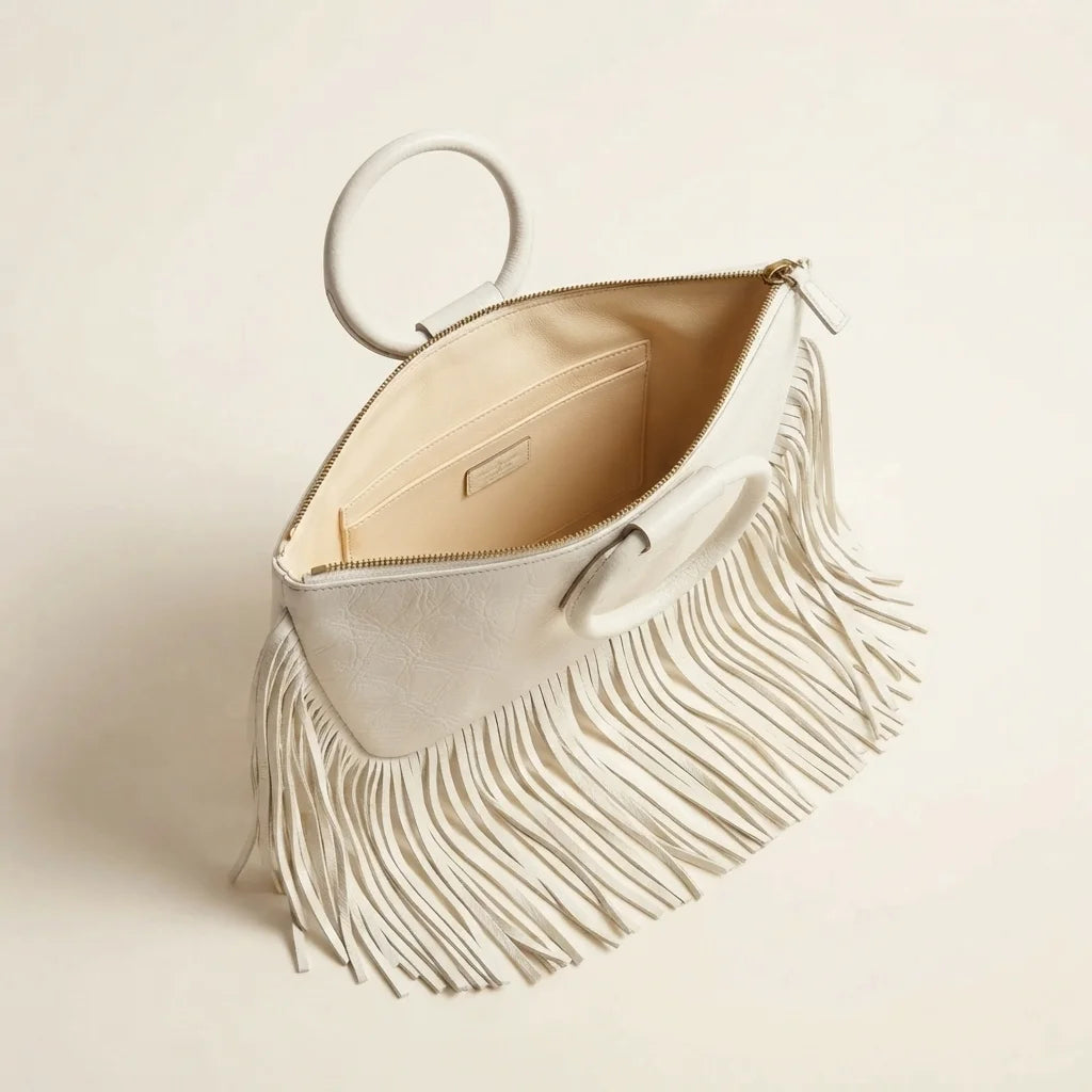 Interior lining and pockets of White fringe clutch bag leather