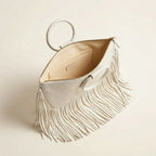 Interior lining and pockets of White fringe clutch bag leather