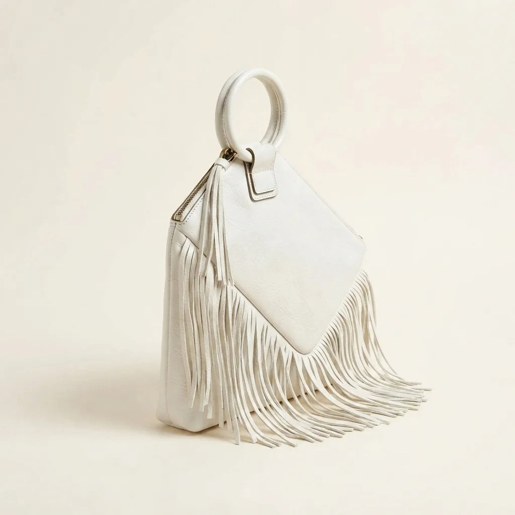 White fringe clutch bag leather, three-quarter angle showing side depth