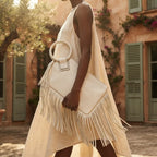 Woman wearing White fringe clutch bag leather with swaying fringe