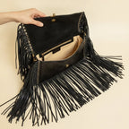 Interior lining and pockets of Black fringe clutch crossbody bag