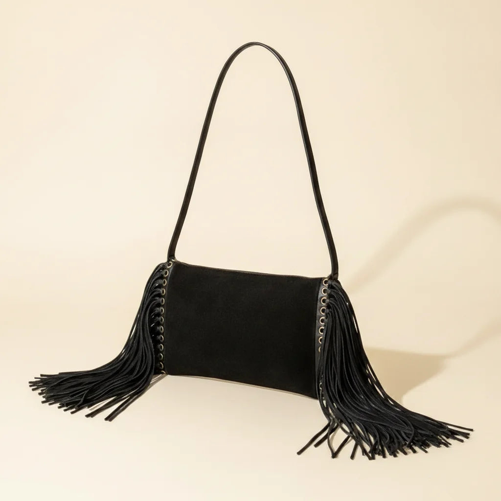 Black fringe clutch crossbody bag, three-quarter angle showing side depth