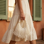 Woman wearing Beige fringe evening bag with swaying fringe