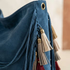 Close-up of fringe stitching and texture on Blue fringe hobo shoulder bags