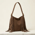 Brown fringe hobo shoulder bags, three-quarter angle showing side depth