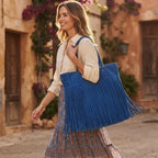 Woman wearing Blue fringe large tote bag with swaying fringe