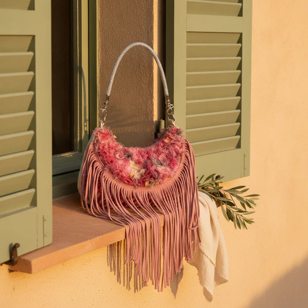 Floral fringe messenger bag styled in a warm Mediterranean setting